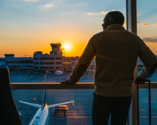 Man enjoying airport sunset