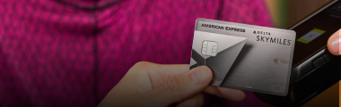 tapping the Delta SkyMiles® Platinum American Express Card on a payment processor